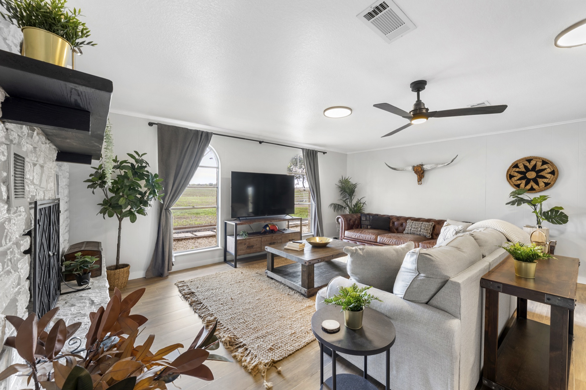 Elegant living room with velvet sofas and exposed wood beams